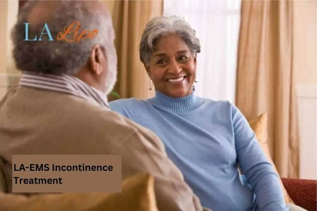Couple sat smiling at each other - LA-EMS treatment Shepperton